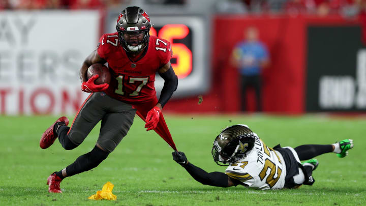 Tampa Bay Buccaneers wide receiver Russell Gage (17) runs with the ball defended by New Orleans Saints cornerback Alontae Taylor (27) in the first quarter at Raymond James Stadium. 