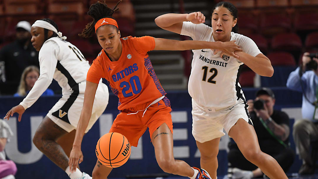 Vanderbilt Commodores women's basketball vs Florida Gators in SEC Tournament on March 7, 2024, at Bon Secours Wellness Arena in Greenville, SC. Florida guard Jeremiah Warren (20) and Vanderbilt forward Khamil Pierre (12) fight for the ball.