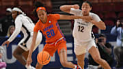 Vanderbilt Commodores women's basketball vs Florida Gators in SEC Tournament on March 7, 2024, at Bon Secours Wellness Arena in Greenville, SC. Florida guard Jeremiah Warren (20) and Vanderbilt forward Khamil Pierre (12) fight for the ball.