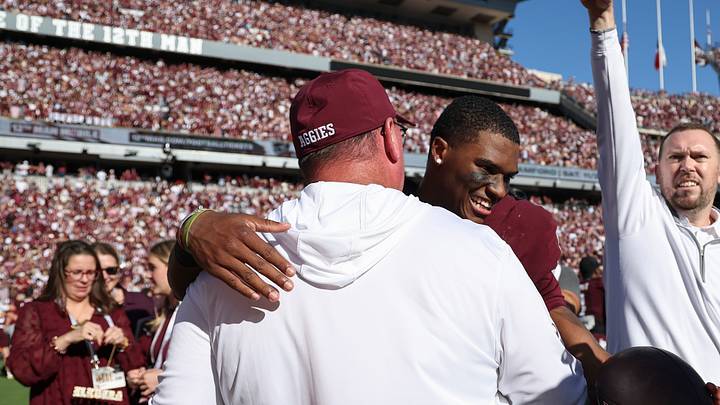 Nov 15, 2025; College Station, Texas, USA; Texas A&M Aggies quarterback Marcel Reed (10) embraces head coach Mike Elko after the game against the South Carolina Gamecocks at Kyle Field. Mandatory Credit: Troy Taormina-Imagn Images