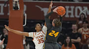Jan 30, 2025; Austin, Texas, USA; Missouri Tigers guard Ashton Judd (24) shoots over Texas Longhorns forward Madison Booker (35) during the first half at Moody Center. Mandatory Credit: Scott Wachter-Imagn Images