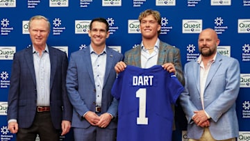 Apr 25, 2025; East Rutherford, NJ, US; New York Giants president John Mara (far left), general manager Joe Schoen (left), Jaxson Dart, and head coach Brian Daboll (right) pose for photos prior to the start of the press conference to introduce the Giants first round draft picks.  Mandatory Credit: Thomas Salus-Imagn Images