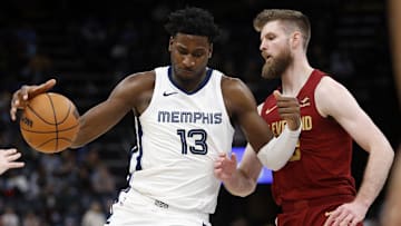 Feb 1, 2024; Memphis, Tennessee, USA; Memphis Grizzlies forward-center Jaren Jackson Jr. (13) drives to the basket as Cleveland Cavaliers forward Dean Wade (32) defends during the second half at FedExForum. Mandatory Credit: Petre Thomas-Imagn Images
