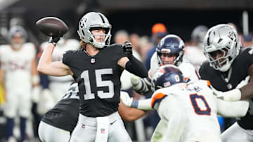 Dec 7, 2025; Paradise, Nevada, USA;  Las Vegas Raiders quarterback Kenny Pickett (15) throws downfield against the Denver Broncos during the second half at Allegiant Stadium.