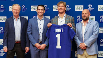 New York Giants president John Mara, GM Joe Schoen, Jaxson Dart, and head coach Brian Daboll pose with Jaxson Dart.