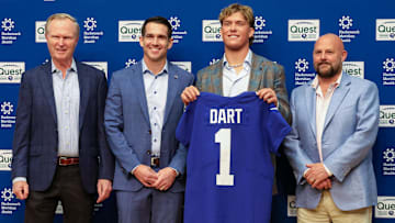 Apr 25, 2025; East Rutherford, NJ, US; New York Giants president John Mara (far left), general manager Joe Schoen (left), Jaxson Dart, and head coach Brian Daboll (right) pose for photos prior to the start of the press conference to introduce the Giants first round draft picks.  Mandatory Credit: Thomas Salus-Imagn Images