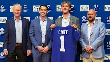 Apr 25, 2025; East Rutherford, NJ, US; New York Giants president John Mara (far left), general manager Joe Schoen (left), Jaxson Dart, and head coach Brian Daboll (right) pose for photos prior to the start of the press conference to introduce the Giants first round draft picks.  Mandatory Credit: Thomas Salus-Imagn Images