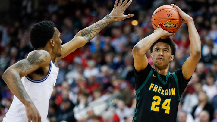 Freedom High School's Donovan Davis (24) shoots the ball against Milwaukee Academy of Science during the WIAA Division 3 state championship game on Saturday, March 22, 2025, at the Kohl Center in Madison, Wis. Milwaukee Academy of Science won the game, 57-54.
Tork Mason/USA TODAY NETWORK-Wisconsin