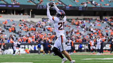Dec 28, 2024; Cincinnati, Ohio, USA; Denver Broncos cornerback Riley Moss (21) catches a pass during warmups before the game against the Cincinnati Bengals at Paycor Stadium. Mandatory Credit: Katie Stratman-Imagn Images