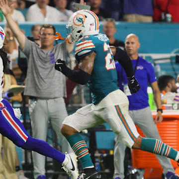 Buffalo Bills running back James Cook (4) runs with the football for a touchdown ahead of Miami Dolphins safety Jordan Poyer (21) during the second quarter at Hard Rock Stadium.