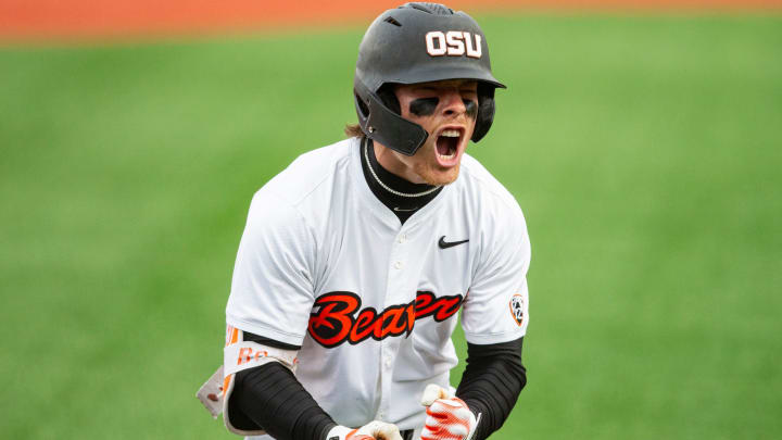 Oregon State's Travis Bazzana (37) celebrates after hitting the team's second solo home run during an NCAA college baseball game against Oregon at Goss Stadium on Friday, April 26, 2024, in Corvallis, Ore.