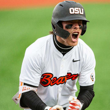 Oregon State's Travis Bazzana (37) celebrates after hitting the team's second solo home run during an NCAA college baseball game against Oregon at Goss Stadium on Friday, April 26, 2024, in Corvallis, Ore.