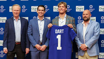 Apr 25, 2025; East Rutherford, NJ, US; New York Giants president John Mara (far left), general manager Joe Schoen (left), Jaxson Dart, and head coach Brian Daboll (right) pose for photos prior to the start of the press conference to introduce the Giants first round draft picks.  Mandatory Credit: Thomas Salus-Imagn Images