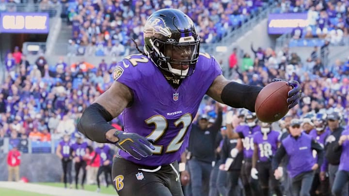 Baltimore Ravens running back Derrick Henry rushes the ball into the end zone to score a touchdown.