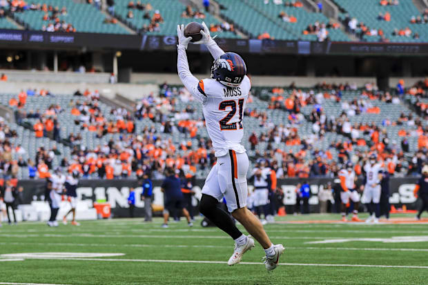 Denver Broncos cornerback Riley Moss (21) catches a pass during warmups before the game against the Cincinnati Bengals.