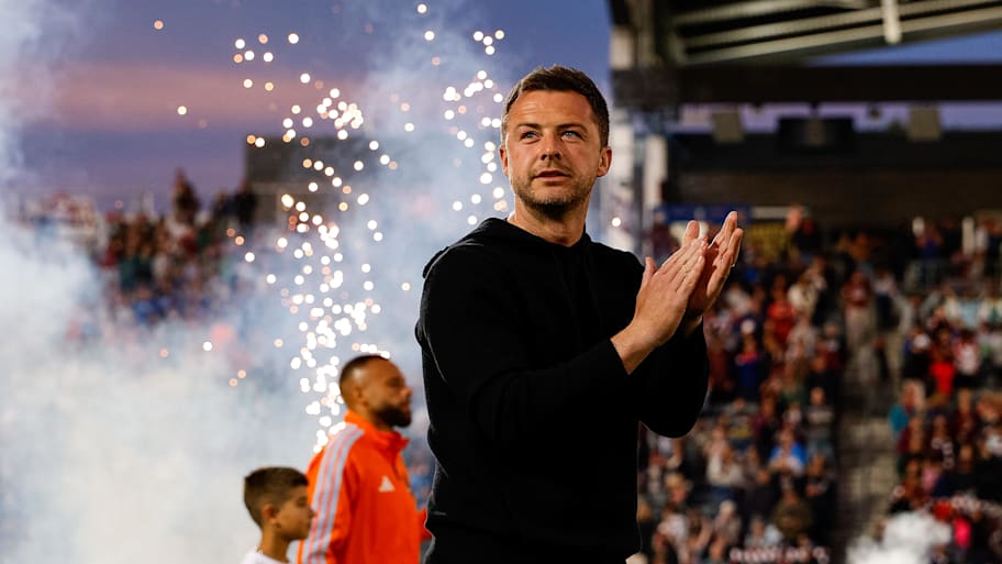 Matt Wells applauding supporters.