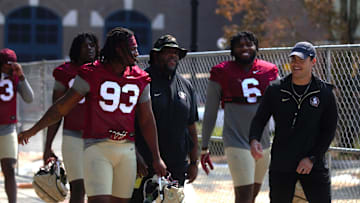 FSU football players walk into the first spring practice of the spring season on Wednesday, March 19, 2025