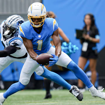 Sep 15, 2024; Charlotte, North Carolina, USA;  Los Angeles Chargers wide receiver Quentin Johnston (1) makes a touchdown catch defended by Carolina Panthers cornerback Jaycee Horn (8) the Carolina Panthers during the first quarter at Bank of America Stadium. Mandatory Credit: Jim Dedmon-Imagn Images