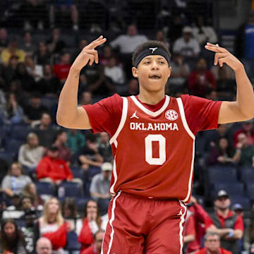 Mar 12, 2025; Nashville, TN, USA;  Oklahoma Sooners guard Jeremiah Fears (0) reacts after a three point basket  against the Georgia Bulldogs during the second half at Bridgestone Arena. Mandatory Credit: Steve Roberts-Imagn Images
