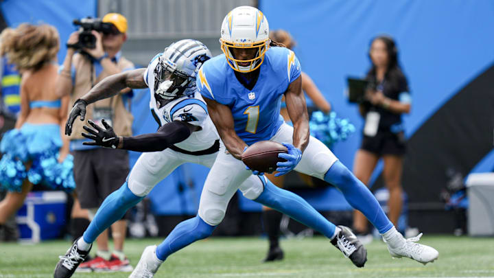 Sep 15, 2024; Charlotte, North Carolina, USA;  Los Angeles Chargers wide receiver Quentin Johnston (1) makes a touchdown catch defended by Carolina Panthers cornerback Jaycee Horn (8) the Carolina Panthers during the first quarter at Bank of America Stadium. Mandatory Credit: Jim Dedmon-Imagn Images