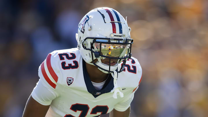 Nov 25, 2023; Tempe, Arizona, USA; An Arizona State Sun Devils player reflects in the helmet visor of Arizona Wildcats cornerback Tacario Davis (23) in the first half of the Territorial Cup at Mountain America Stadium. Mandatory Credit: Mark J. Rebilas-Imagn Images