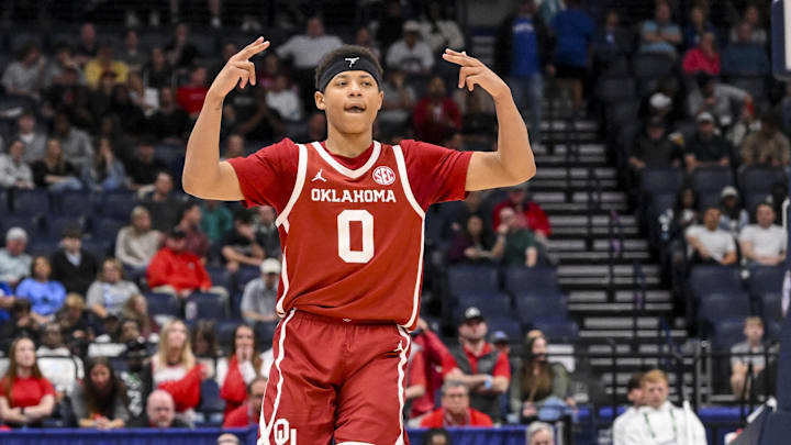 Mar 12, 2025; Nashville, TN, USA;  Oklahoma Sooners guard Jeremiah Fears (0) reacts after a three point basket  against the Georgia Bulldogs during the second half at Bridgestone Arena. Mandatory Credit: Steve Roberts-Imagn Images