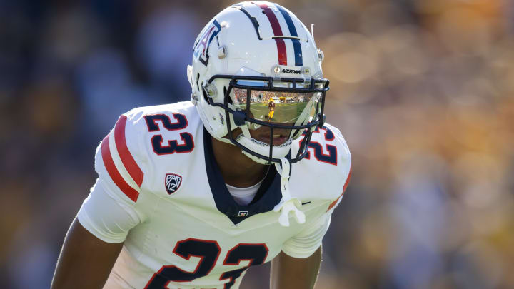 Nov 25, 2023; Tempe, Arizona, USA; An Arizona State Sun Devils player reflects in the helmet visor of Arizona Wildcats cornerback Tacario Davis (23) in the first half of the Territorial Cup at Mountain America Stadium.