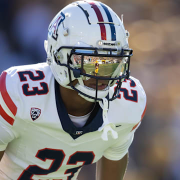 Nov 25, 2023; Tempe, Arizona, USA; An Arizona State Sun Devils player reflects in the helmet visor of Arizona Wildcats cornerback Tacario Davis (23) in the first half of the Territorial Cup at Mountain America Stadium. Mandatory Credit: Mark J. Rebilas-Imagn Images