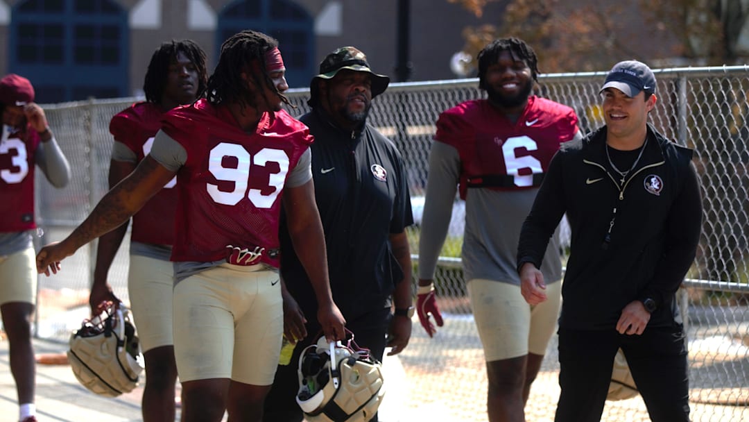 FSU football players walk into the first spring practice of the spring season on Wednesday, March 19, 2025