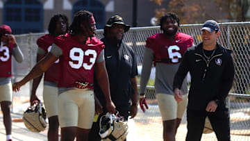 FSU football players walk into the first spring practice of the spring season on Wednesday, March 19, 2025