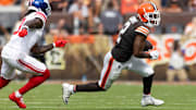 Sep 22, 2024; Cleveland, Ohio, USA; Cleveland Browns wide receiver Amari Cooper (2) runs the ball away from New York Giants cornerback Deonte Banks (3) during the fourth quarter at Huntington Bank Field. Mandatory Credit: Scott Galvin-Imagn Images