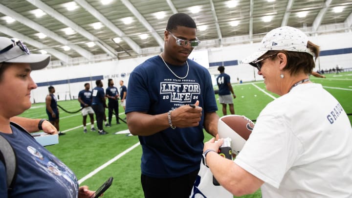Penn State defensive end Abdul Carter signs autographs for fans during the 21st annual Lift for Life at Holuba Hall. 