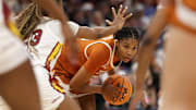 Apr 4, 2025; Tampa, FL, USA;  Texas Longhorns forward Madison Booker (35) controls the ball against South Carolina Gamecocks guard Bree Hall (23) during the second quarter in a semifinal of the women's 2025 NCAA tournament at Amalie Arena. Mandatory Credit: Nathan Ray Seebeck-Imagn Images