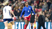 Nov 30, 2024; London, England;  United states defender Naomi Girma (4) dribbles the ball in the first half of an International friendly at Wembley Stadium. Mandatory Credit: Peter van den Berg-Imagn Images