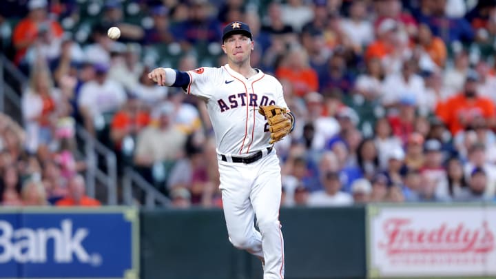 Jul 13, 2024; Houston, Texas, USA; Houston Astros third baseman Alex Bregman (2) throws a fielded ball to first base for an out against the Texas Rangers during the game at Minute Maid Park.