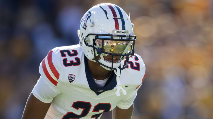 Nov 25, 2023; Tempe, Arizona, USA; An Arizona State Sun Devils player reflects in the helmet visor of Arizona Wildcats cornerback Tacario Davis (23) in the first half of the Territorial Cup at Mountain America Stadium