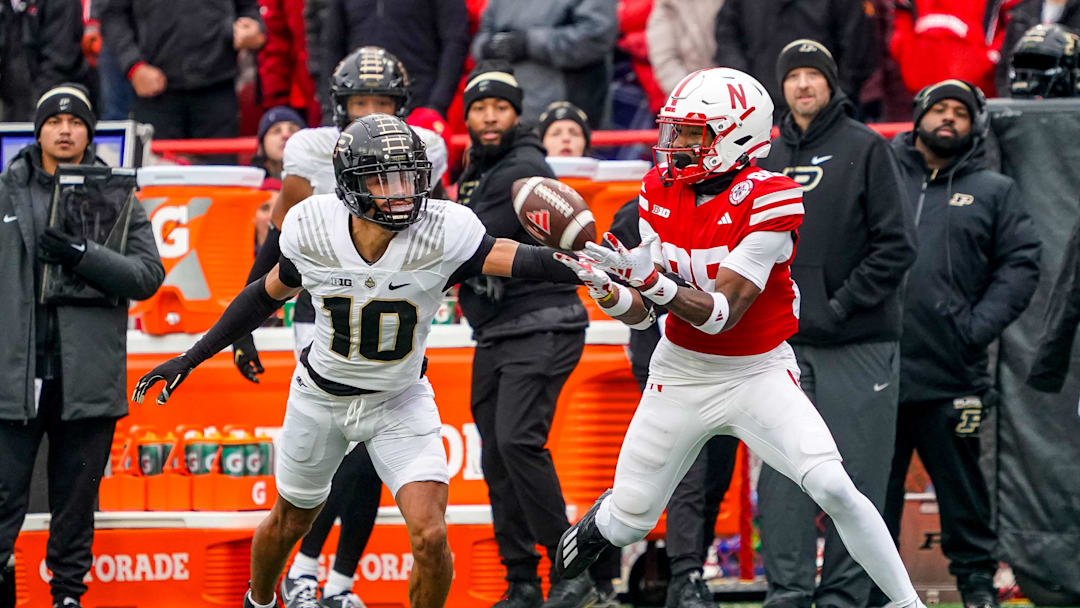 Oct 28, 2023; Lincoln, Nebraska, USA; Purdue Boilermakers defensive back Cam Allen (10) breaks up a pass to Nebraska Cornhuskers wide receiver Jaidyn Doss (85) during the first quarter at Memorial Stadium. Mandatory Credit: Dylan Widger-Imagn Images