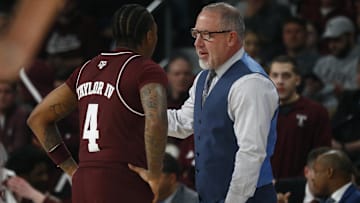 Feb 18, 2025; Starkville, Mississippi, USA; Texas A&M Aggies head coach Buzz Williams talks with guard Wade Taylor IV (4) during the first half against the Mississippi State Bulldogs at Humphrey Coliseum. Mandatory Credit: Petre Thomas-Imagn Images