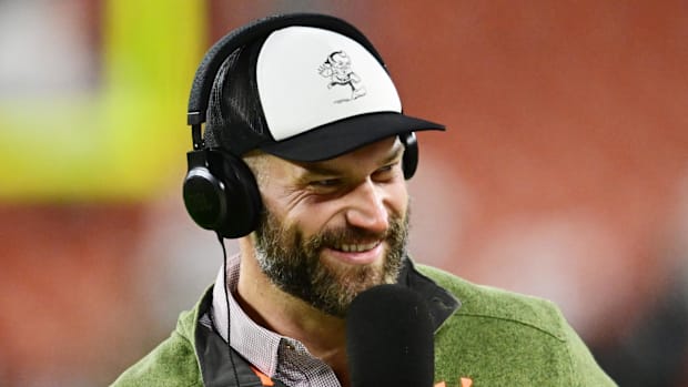 Former Cleveland Browns player Joe Thomas reports on the sidelines before the game between the Browns and the New York Jets a