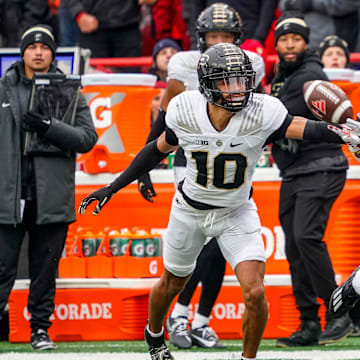 Oct 28, 2023; Lincoln, Nebraska, USA; Purdue Boilermakers defensive back Cam Allen (10) breaks up a pass to Nebraska Cornhuskers wide receiver Jaidyn Doss (85) during the first quarter at Memorial Stadium. Mandatory Credit: Dylan Widger-Imagn Images