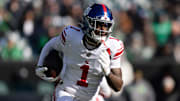Jan 5, 2025; Philadelphia, Pennsylvania, USA; New York Giants wide receiver Malik Nabers (1) runs with the ball against the Philadelphia Eagles during the first quarter at Lincoln Financial Field.  