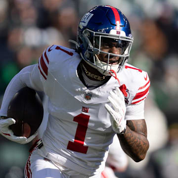 Jan 5, 2025; Philadelphia, Pennsylvania, USA; New York Giants wide receiver Malik Nabers (1) runs with the ball against the Philadelphia Eagles during the first quarter at Lincoln Financial Field.  