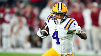 Nov 4, 2023; Tuscaloosa, Alabama, USA; LSU Tigers running back John Emery Jr. (4) carries the ball against the Alabama Crimson Tide during the second quarter at Bryant-Denny Stadium. Mandatory Credit: John David Mercer-Imagn Images