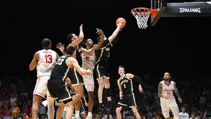 Mar 28, 2025; Indianapolis, IN, USA; Purdue Boilermakers guard Braden Smith (3) grabs a rebound against Houston Cougars guard Emanuel Sharp (21)in the second half during a Midwest Regional semifinal of the 2025 NCAA tournament at Lucas Oil Stadium. Mandatory Credit: Robert Goddin-Imagn Images