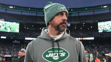 Dec 24, 2023; East Rutherford, New Jersey, USA; New York Jets quarterback Aaron Rodgers (8) on the field after the game against the Washington Commanders at MetLife Stadium. Mandatory Credit: Vincent Carchietta-USA TODAY Sports 