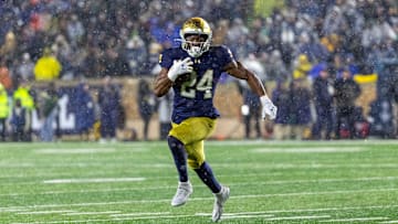 Nov 8, 2025; South Bend, Indiana, USA; Notre Dame Fighting Irish running back Jadarian Price (24) runs the ball against the Navy Midshipmen during the second half at Notre Dame Stadium. 