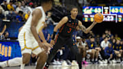 Jan 25, 2025; Berkeley, California, USA; Miami Hurricanes guard Jalil Bethea (3) looks to pass away from California Golden Bears defensive pressure during the second half at Haas Pavilion. Mandatory Credit: D. Ross Cameron-Imagn Images
