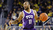 Nov 15, 2024; Ann Arbor, Michigan, USA;  TCU Horned Frogs guard Frankie Collins (11) dribbles in the second half against the Michigan Wolverines at Crisler Center. Mandatory Credit: Rick Osentoski-Imagn Images