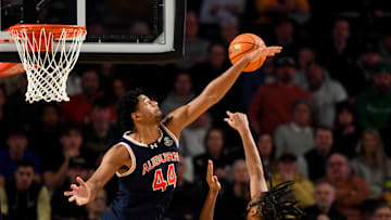 Feb 11, 2025; Nashville, Tennessee, USA; Auburn Tigers center Dylan Cardwell (44) blocks the shot of  Vanderbilt Commodores forward Devin McGlockton (99) during the second half at Memorial Gymnasium. Mandatory Credit: Steve Roberts-Imagn Images