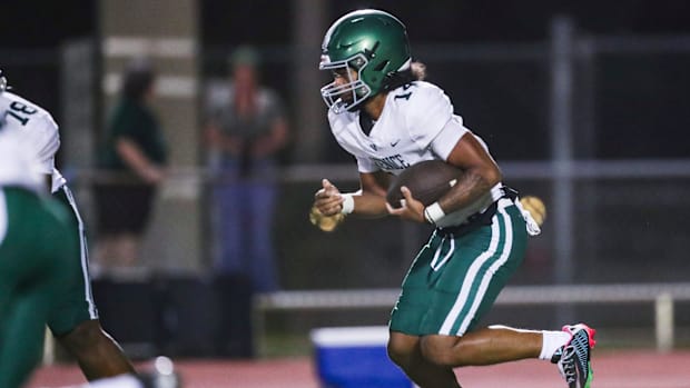 Venice Indians quarterback Sean Long (14) runs the ball during the fourth quarter of a spring football game against the Naple